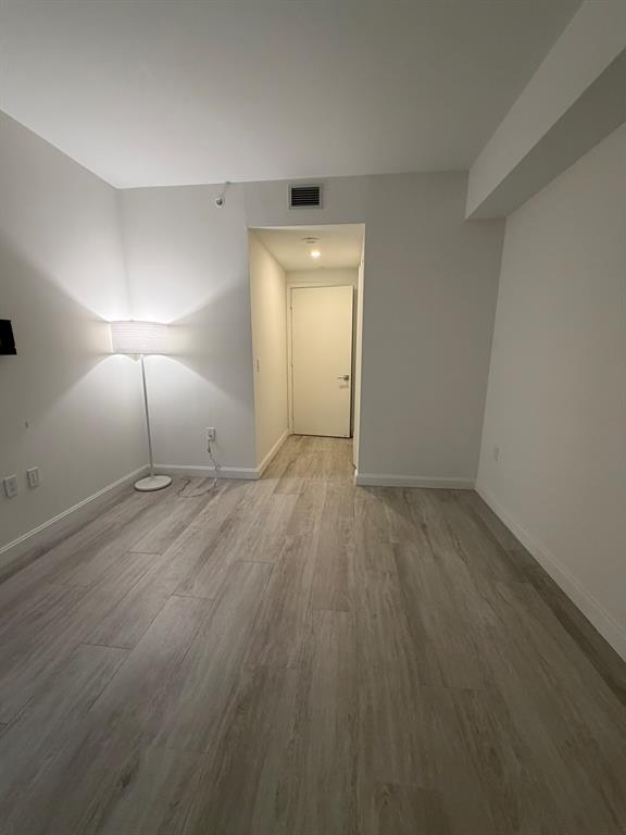 45 Southwest 9th Street, Unit 3110 Miami, FL 33130 - Photo 15 of 19 a view of a room with wooden floor