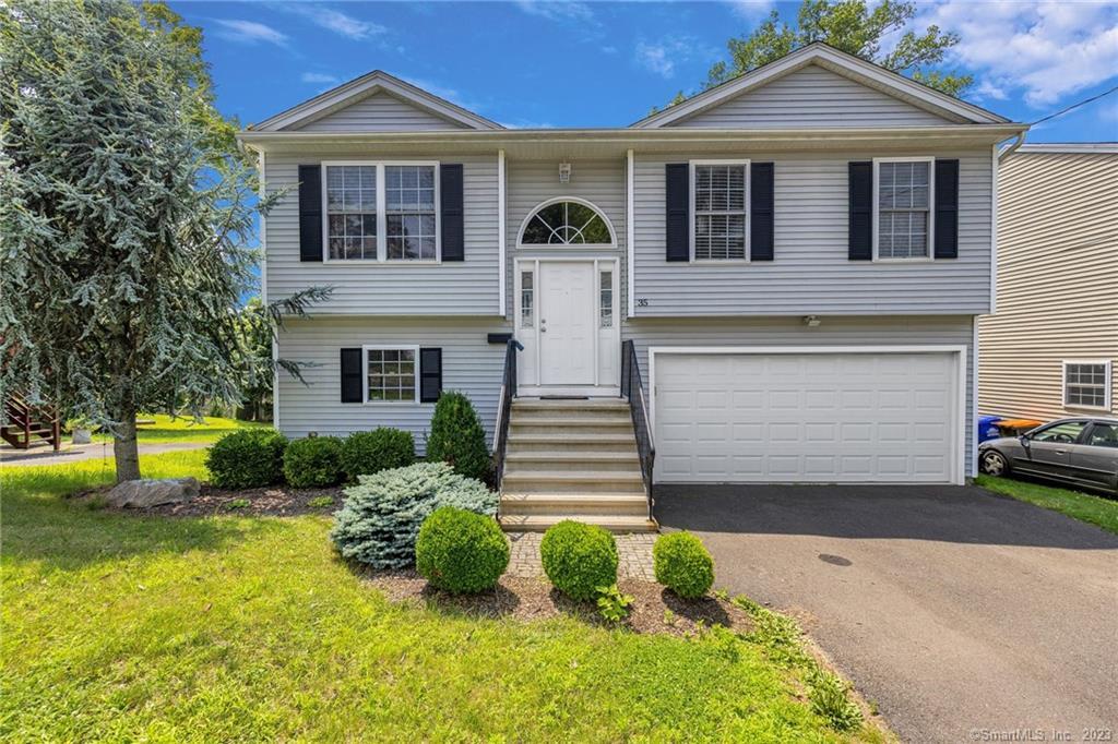 35 Maple Avenue Wallingford, CT 06492 - Photo 1 of 1 a front view of a house with garden