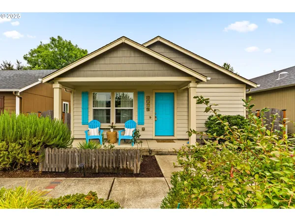a front view of house with yard outdoor seating and barbeque oven
