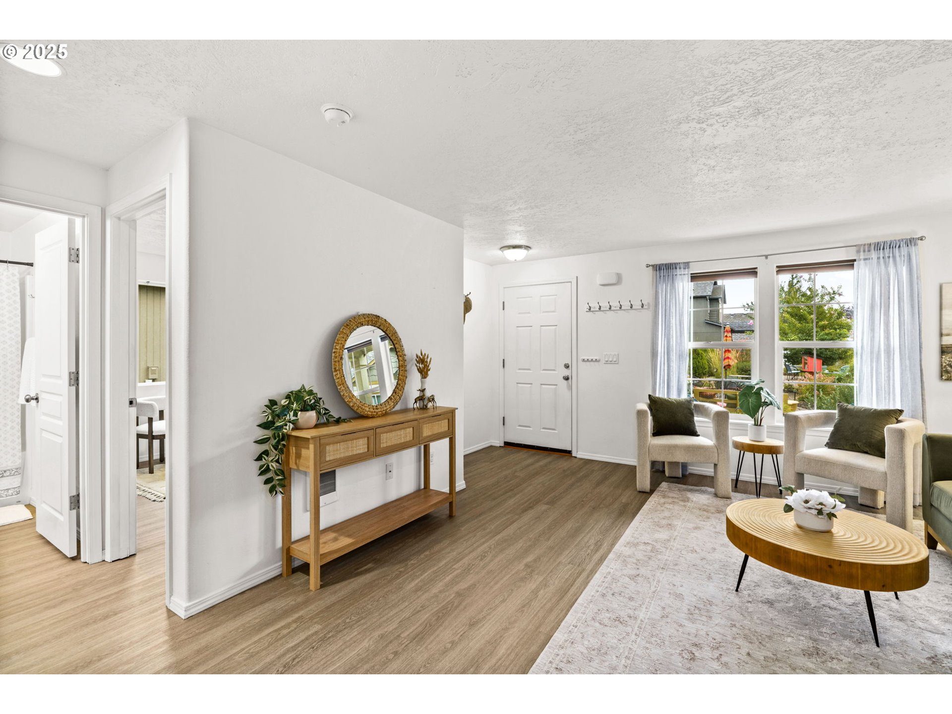 3031 Hummingbird Lane Eugene, OR 97405 - Photo 11 of 28 a living room with furniture and a wooden floor