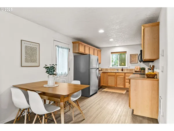 a kitchen with a table and chairs