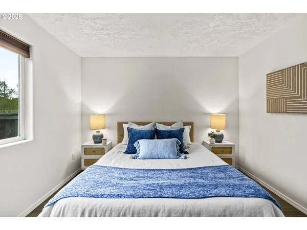 a bedroom with a bed and window