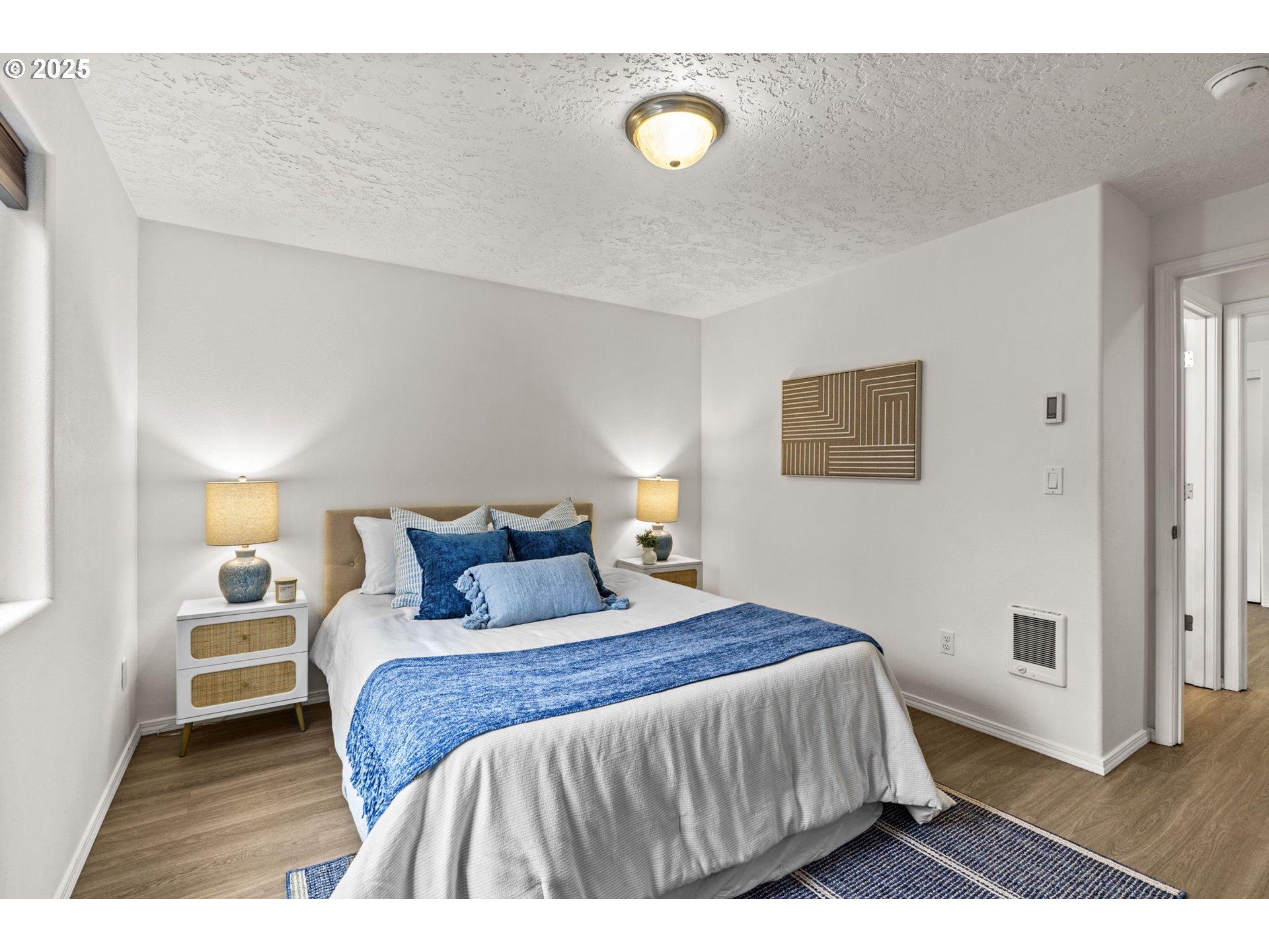 3031 Hummingbird Lane Eugene, OR 97405 - Photo 21 of 28 a bedroom with a bed and a night stand