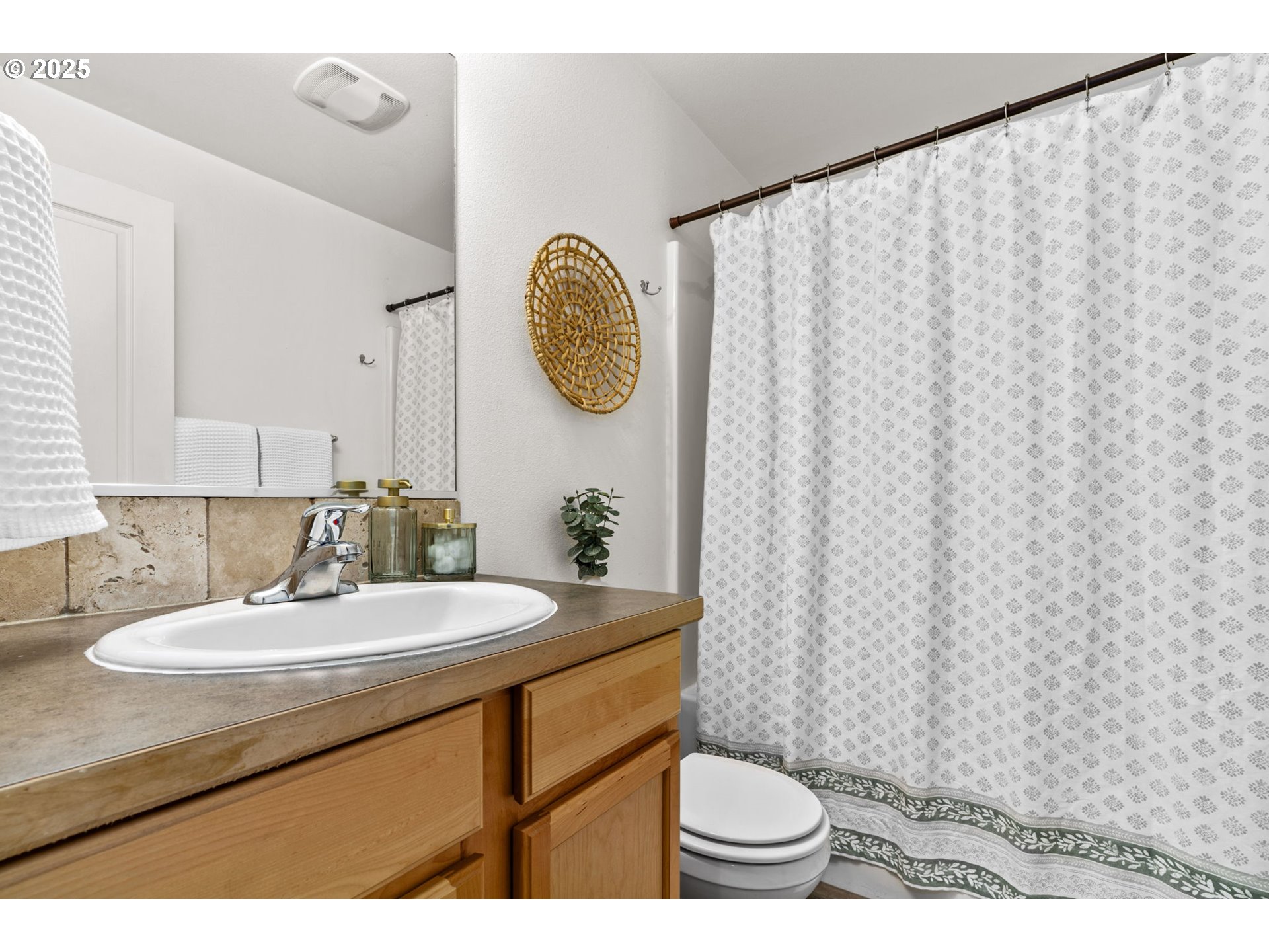 3031 Hummingbird Lane Eugene, OR 97405 - Photo 23 of 28 a bathroom with a sink toilet and a mirror