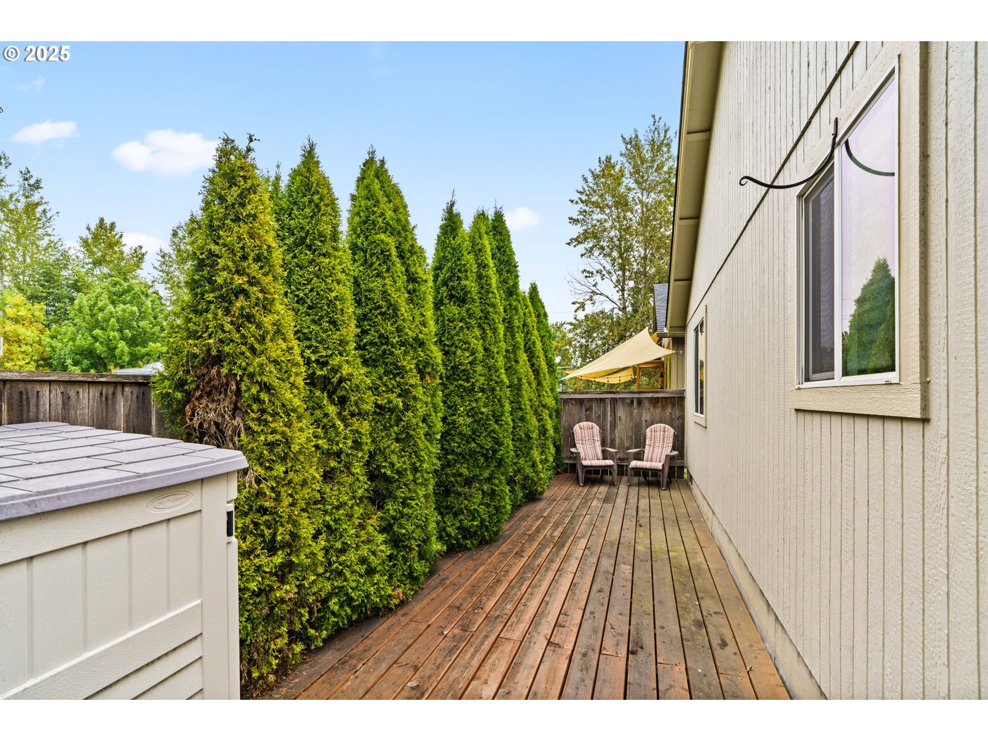 3031 Hummingbird Lane Eugene, OR 97405 - Photo 24 of 28 a balcony with table and chairs and wooden fence