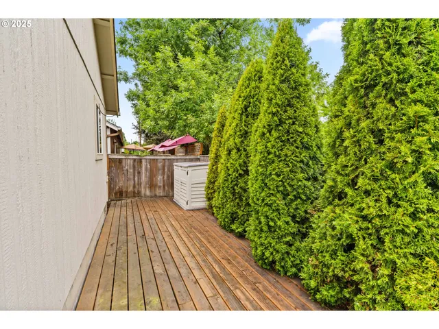 a view of balcony with wooden floor