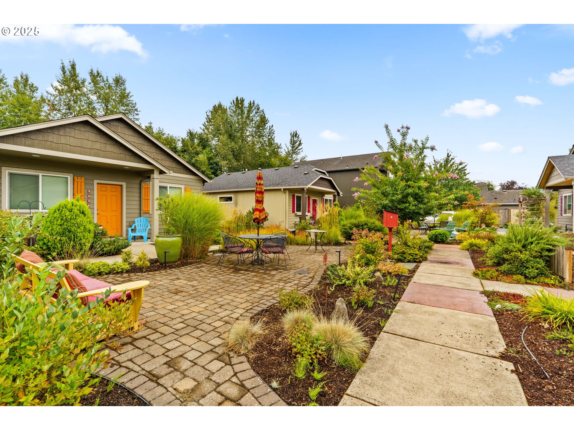 3031 Hummingbird Lane Eugene, OR 97405 - Photo 27 of 28 a view of a house with backyard and garden