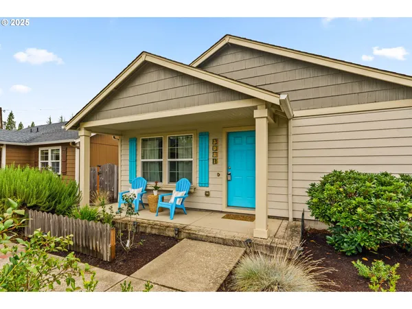 a front view of house with yard and outdoor seating
