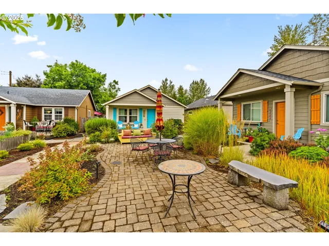 a view of a house with swimming pool and sitting area