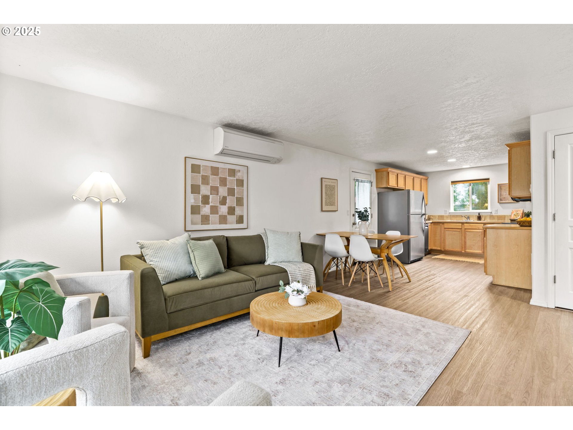 3031 Hummingbird Lane Eugene, OR 97405 - Photo 6 of 28 a living room with furniture wooden floor and a table