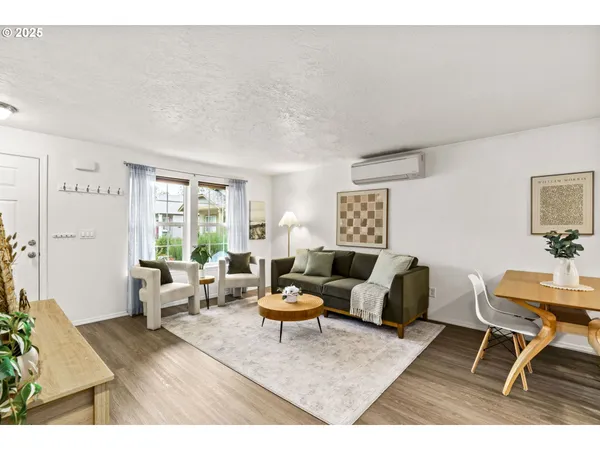 a living room with furniture and a table