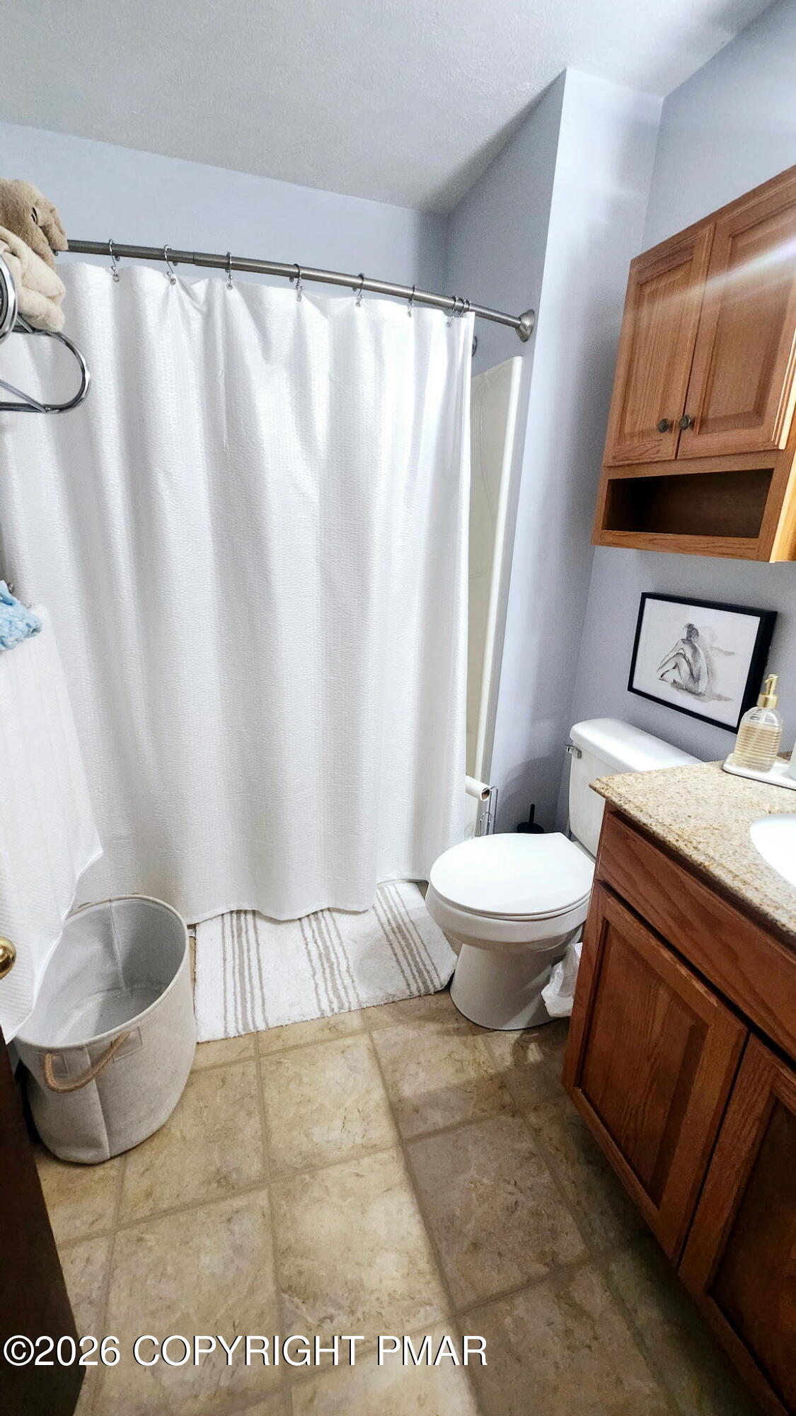5709 Decker Road Bushkill, PA 18324 - Photo 18 of 32 a bathroom with a toilet and a shower curtain