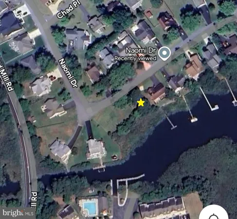 an aerial view of a residential building with outdoor space
