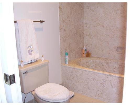 7727 La Mirada Drive, Unit 118 Boca Raton, FL 33433 - Photo 8 of 16 a bathroom with a sink a toilet and shower