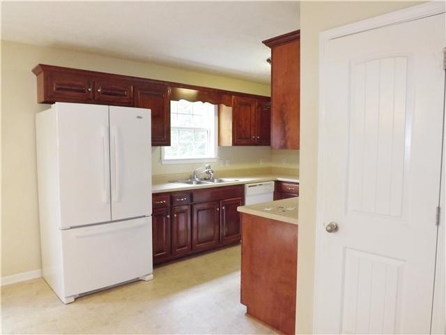 310 Indian Springs Circle Manchester, TN 37355 - Photo 13 of 31 a kitchen with stainless steel appliances granite countertop a refrigerator a sink and dishwasher