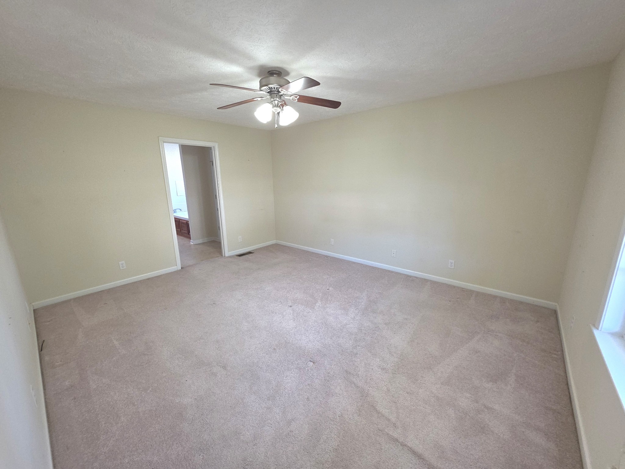 310 Indian Springs Circle Manchester, TN 37355 - Photo 19 of 31 a view of an empty room with a chandelier fan