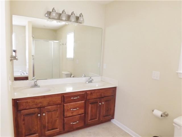 310 Indian Springs Circle Manchester, TN 37355 - Photo 20 of 31 a bathroom with a double vanity sink and a mirror