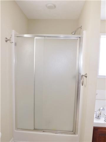 310 Indian Springs Circle Manchester, TN 37355 - Photo 22 of 31 a bathroom with a glass shower door
