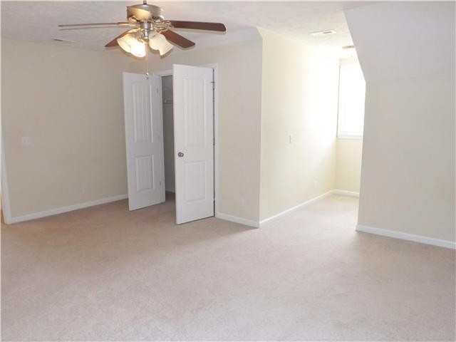 310 Indian Springs Circle Manchester, TN 37355 - Photo 25 of 31 an empty room with a chandelier fan and a window