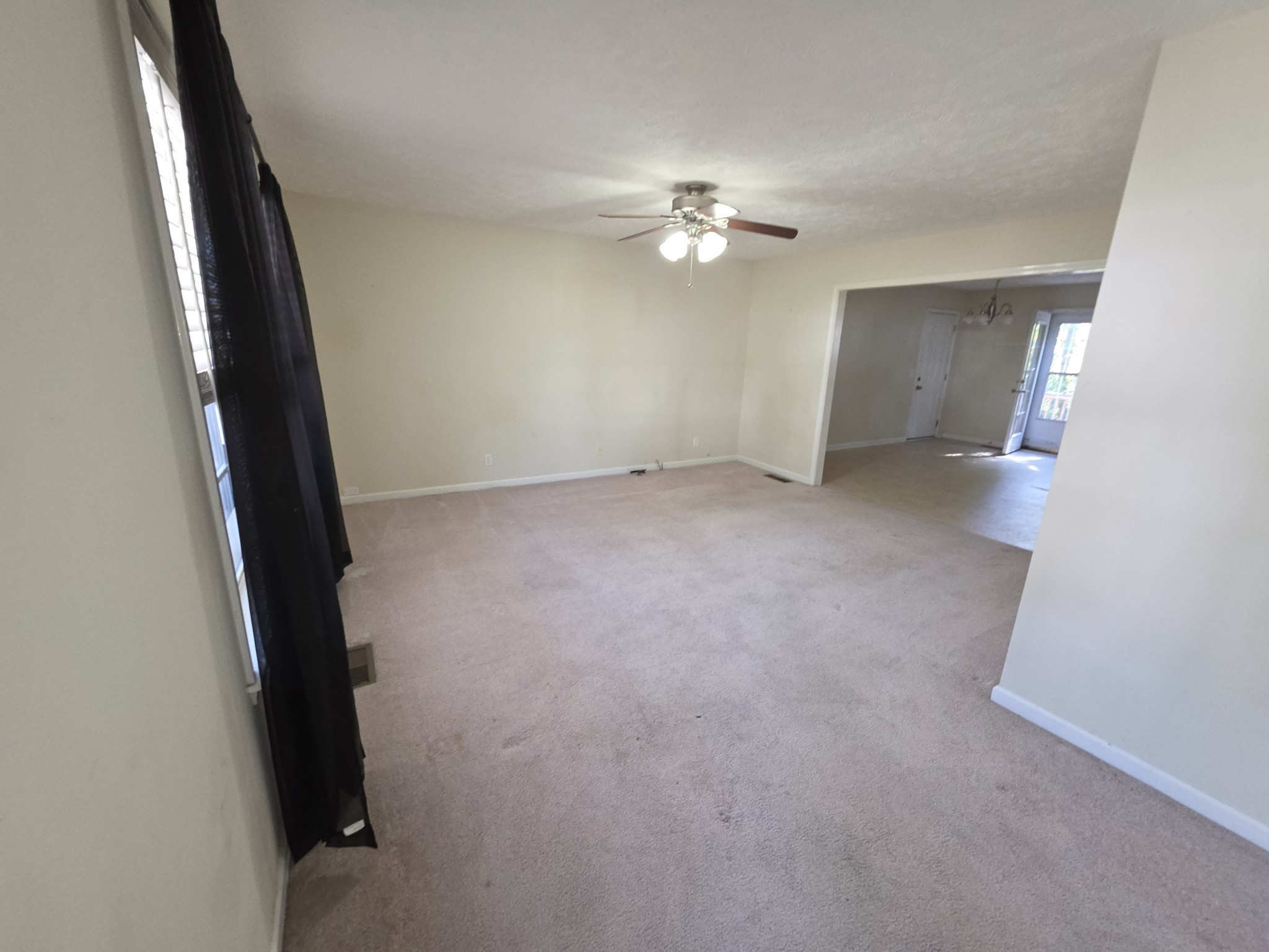 310 Indian Springs Circle Manchester, TN 37355 - Photo 7 of 31 an empty room with windows and fan