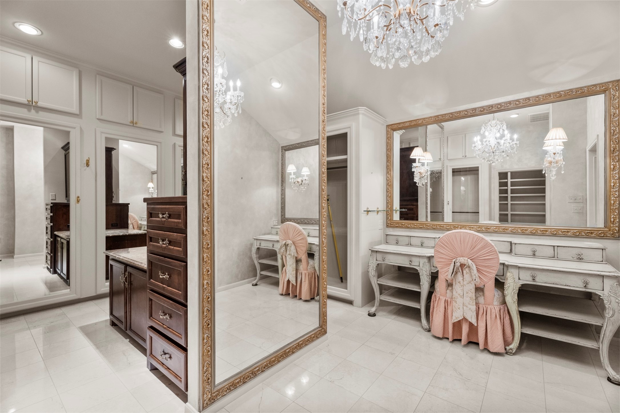 6106 Larkmount Drive Spring, TX 77389 - Photo 31 of 50 Chandelier lit DIVA closet with mirrors, mirrored wardrobe doors, custom built in furniture and gorgeous vanity desk. This closet is 18x14!