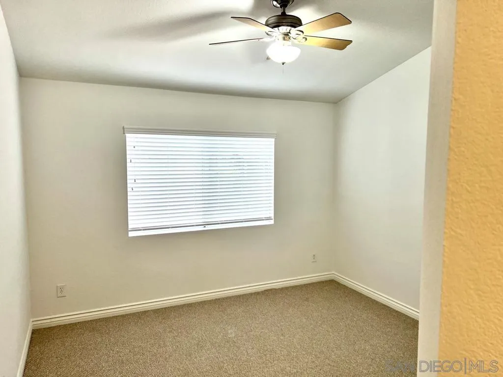 31843 Corte Priego Temecula, CA 92592 - Photo 10 of 23 an empty room with a window and a fan