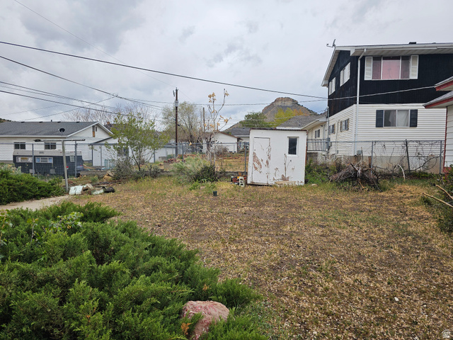 744 Royal Street Helper, UT 84526 - Photo 32 of 33 Fenced backyard with a shed