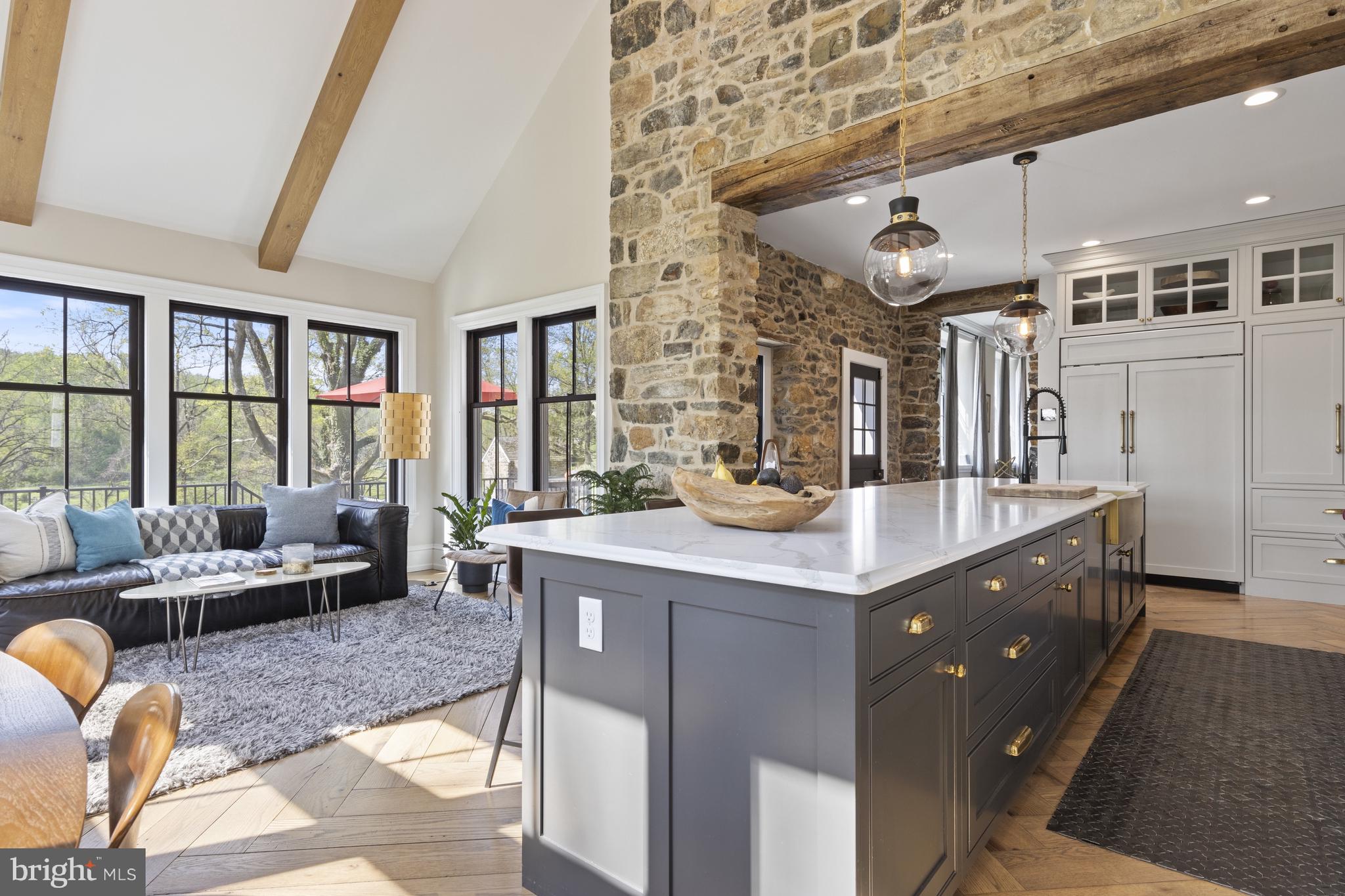 1250 Hillendale Road Chadds Ford, PA 19317 - Photo 25 of 76 a living room with granite countertop kitchen island stainless steel appliances a table and a large window