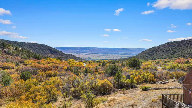 a view of mountain with sunset