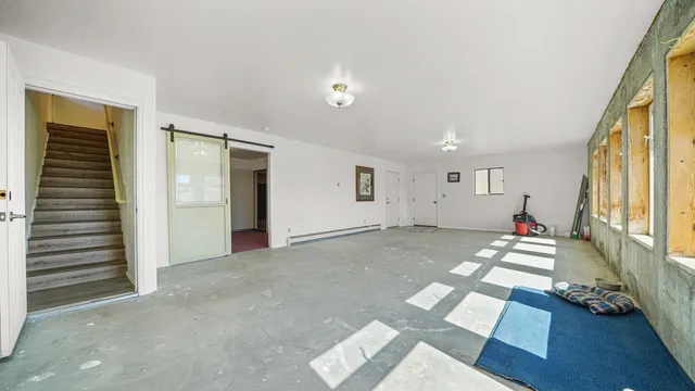 a room with stairs and furniture