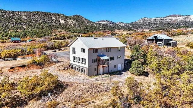 a view of a house with a mountain in the background