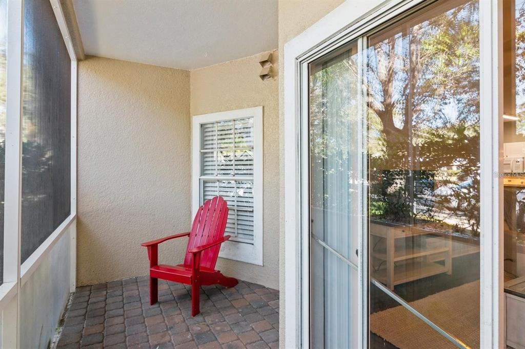 5174 Northridge Road, Unit 111 Sarasota, FL 34238 - Photo 6 of 9 a chair and table in a room