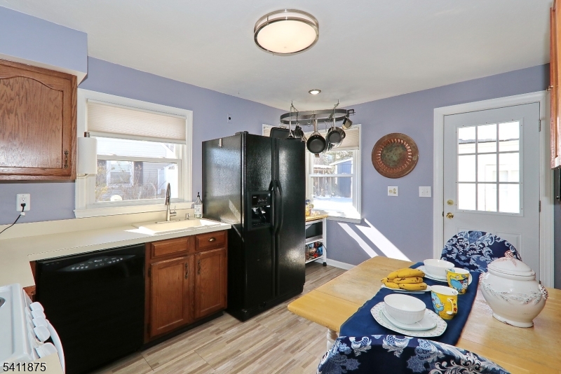 1314 Wood Valley Road Mountainside, NJ 07092 - Photo 12 of 40 a kitchen with stainless steel appliances granite countertop a sink stove and refrigerator