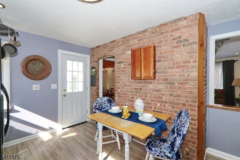 1314 Wood Valley Road Mountainside, NJ 07092 - Photo 13 of 40 a view of a dining room with furniture and chandelier