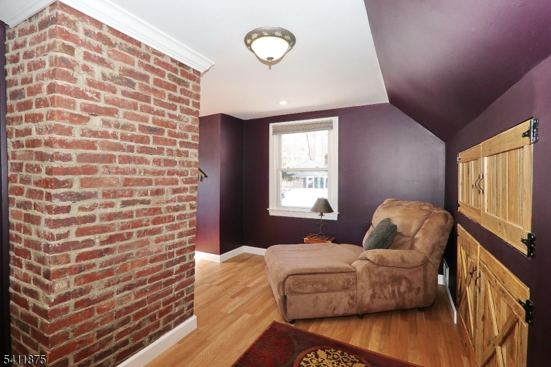 1314 Wood Valley Road Mountainside, NJ 07092 - Photo 27 of 40 a bedroom with a bed and a flat screen tv