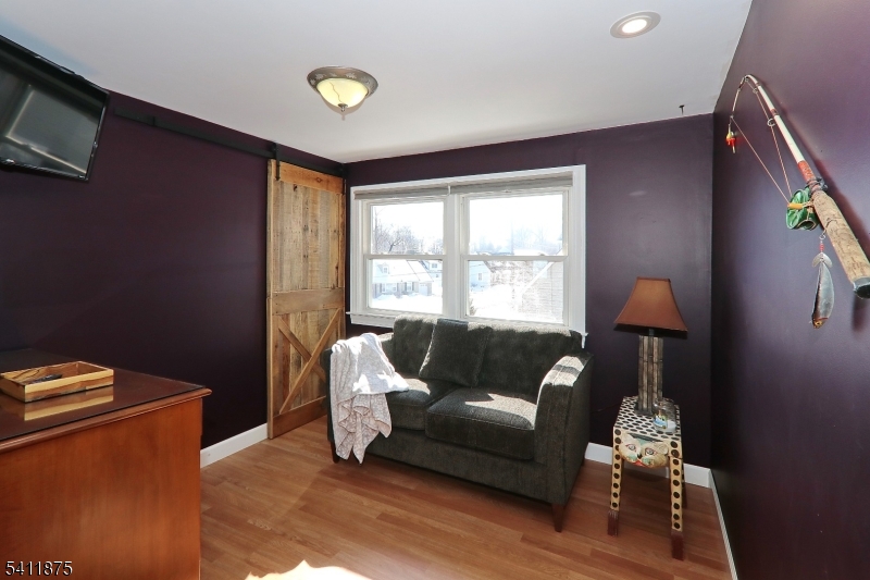 1314 Wood Valley Road Mountainside, NJ 07092 - Photo 29 of 40 a living room with furniture and a window