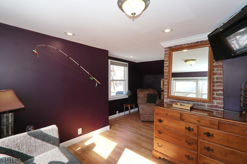 1314 Wood Valley Road Mountainside, NJ 07092 - Photo 30 of 40 a living room with furniture and a flat screen tv