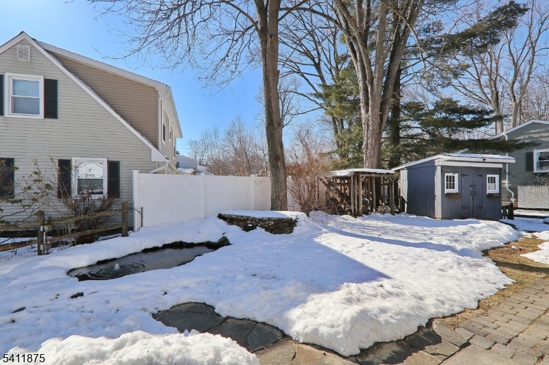 1314 Wood Valley Road Mountainside, NJ 07092 - Photo 33 of 40 a view of a house with snow on the road