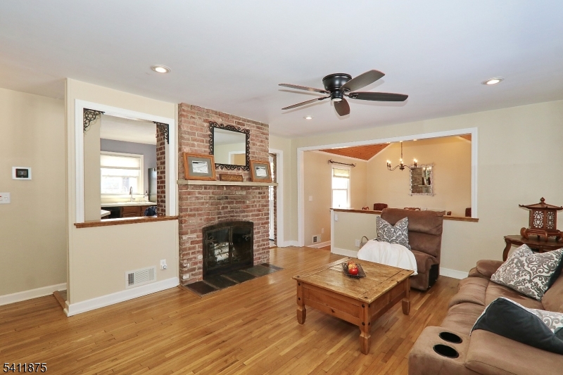 1314 Wood Valley Road Mountainside, NJ 07092 - Photo 5 of 40 a living room with furniture and a fireplace