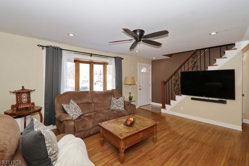 1314 Wood Valley Road Mountainside, NJ 07092 - Photo 7 of 40 a living room with furniture and a flat screen tv