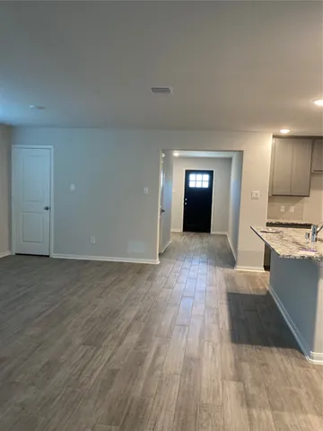 a view of a kitchen with a sink and a stove