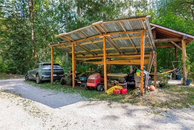 a view of a car parked in the yard