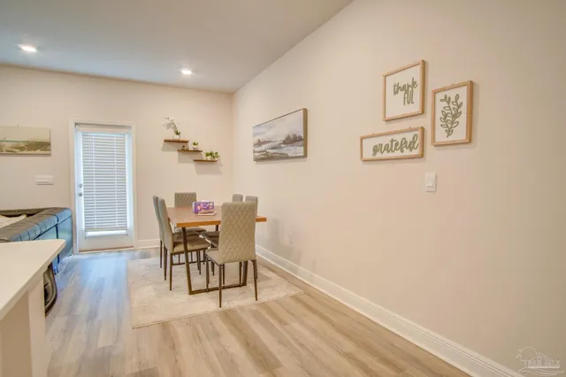 a view of a livingroom with furniture and wooden floor