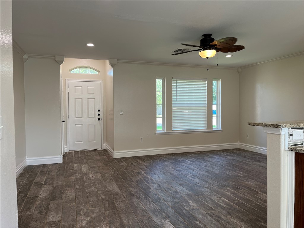 1219 Sacramento Street Portland, TX 78374 - Photo 11 of 40 wooden floor in an empty room with a window
