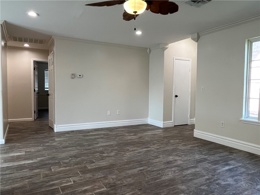 1219 Sacramento Street Portland, TX 78374 - Photo 14 of 40 an empty room with wooden floor and windows