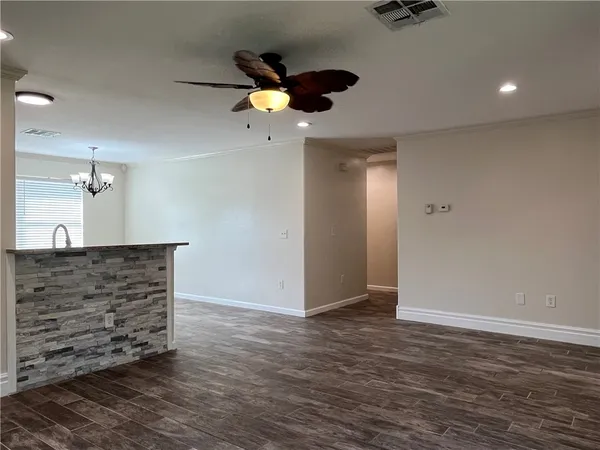 a view of room with a ceiling fan