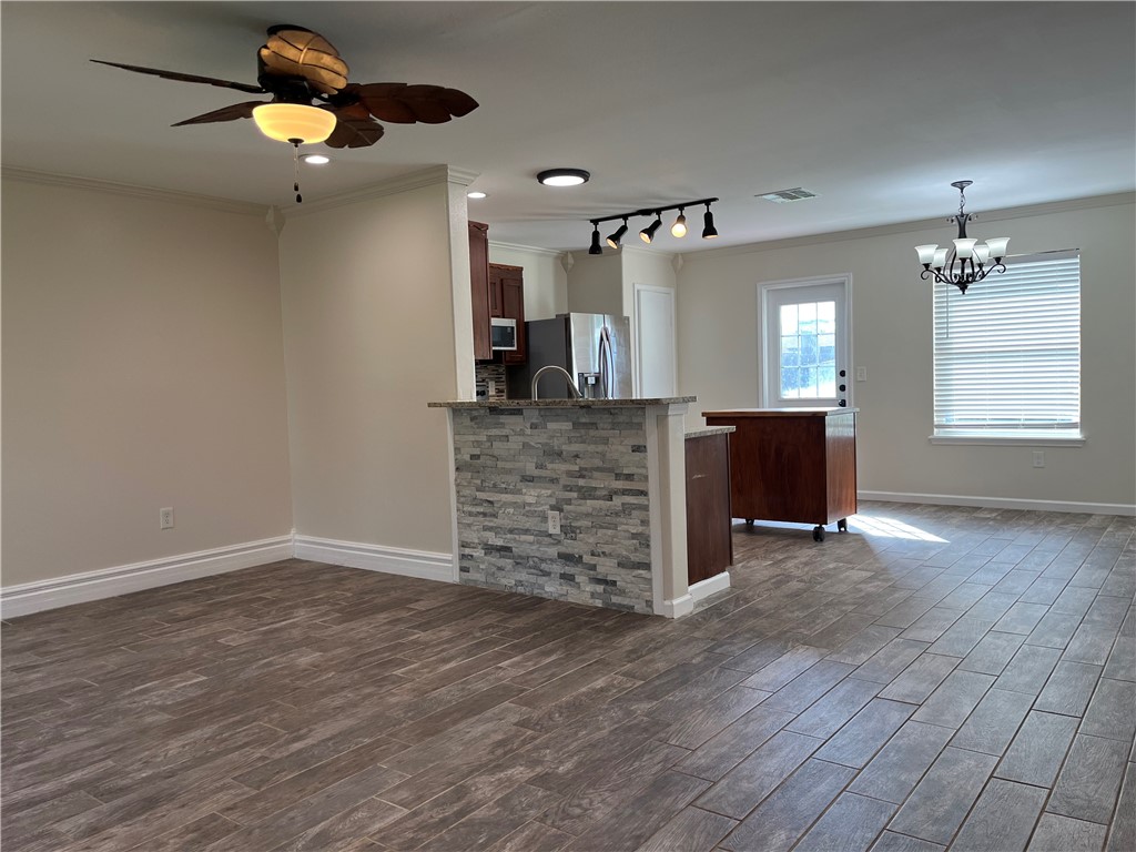 1219 Sacramento Street Portland, TX 78374 - Photo 2 of 40 a view of a livingroom with hardwood floor and a ceiling fan