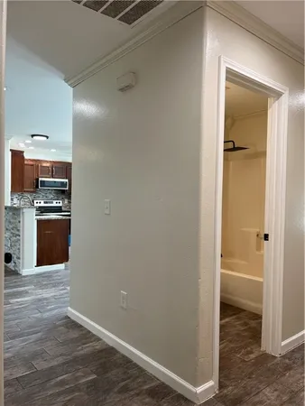 a view of a kitchen from the hallway