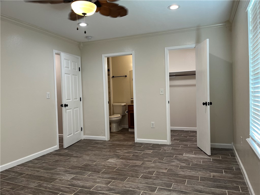 1219 Sacramento Street Portland, TX 78374 - Photo 30 of 40 an empty room with closet and a chandelier fan