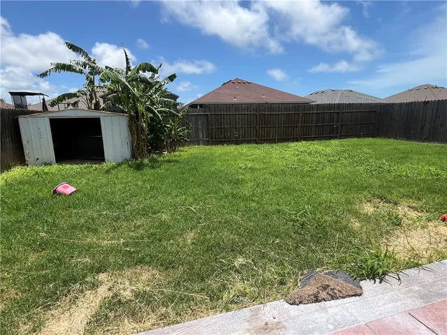 a front view of a house with a yard and a garage